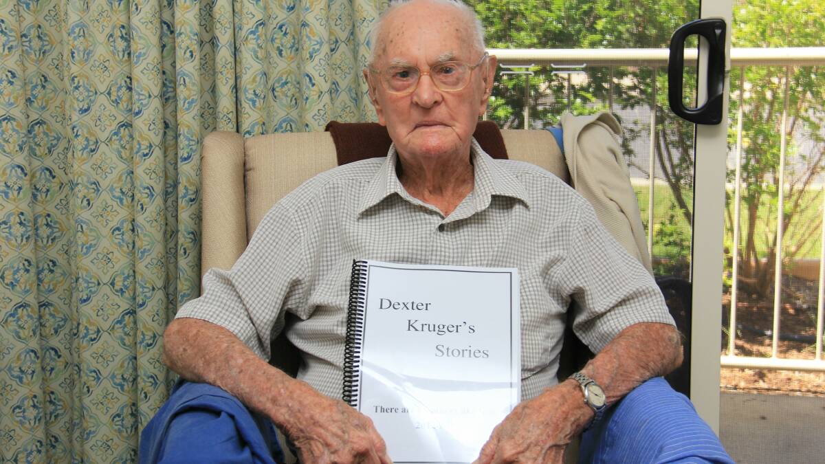 Dexter Kruger pictured with one of the books he compiled following his retirement.