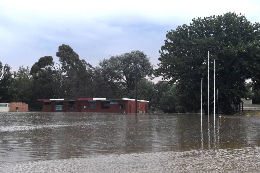 Washout: A flooded oval at Hammon Park. Pictures: Adam Trafford