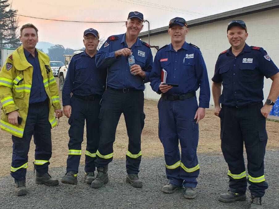 ALL SMILES: Members of local Fire and Rescue NSW teams make sure to keep each other laughing even when the going gets tough. 