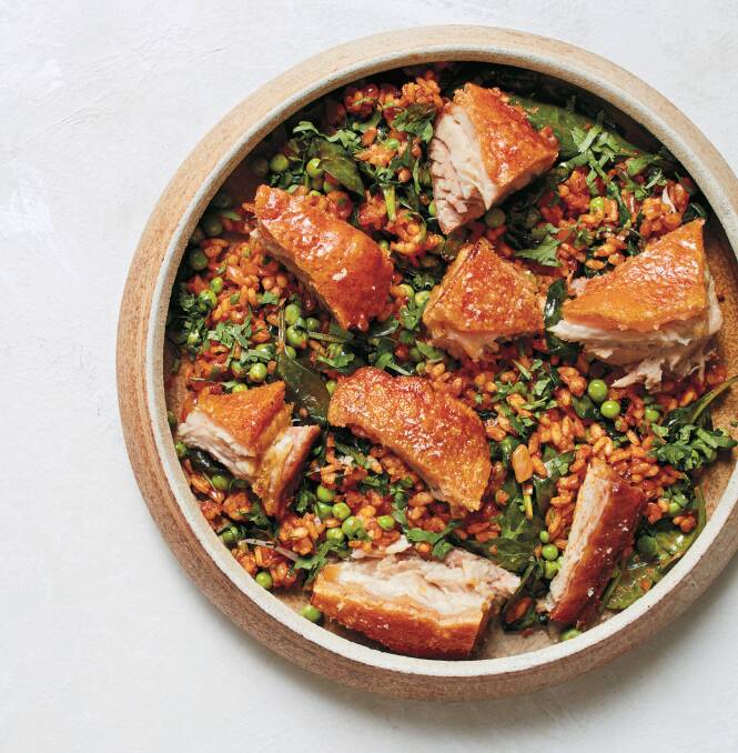 Roasted pork belly with pea and onion rice. Picture: Bec Hudson