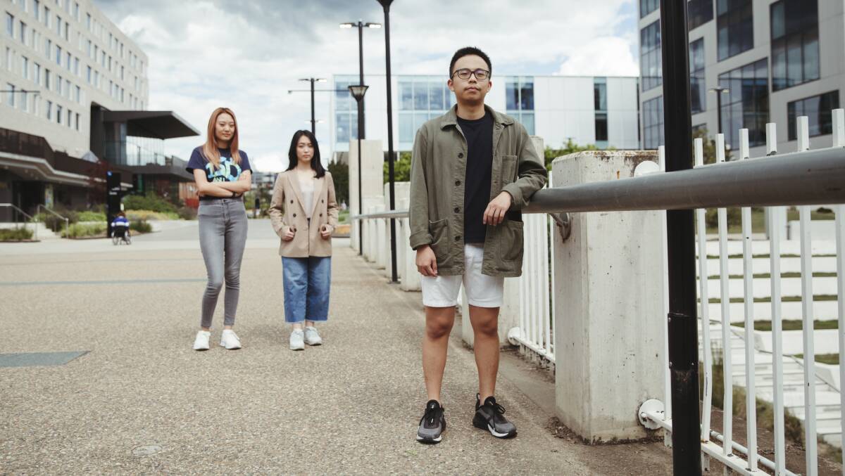 ANU international student representatives Helen Tong, Ying Loh and Benedict Chin want certainty for their classmates. Picture: Dion Georgopoulos 