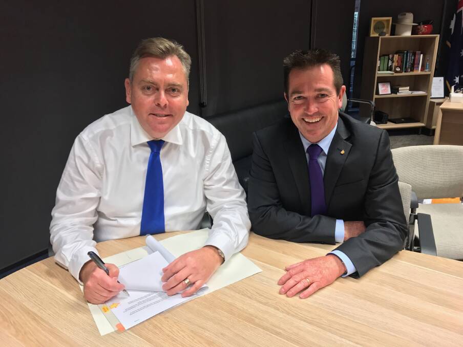 THE TICK OF APPROVAL: Minister for Planning and Housing Anthony Roberts and Minister for Lands and Forestry Paul Toole approved an expansion for Borg's timber processing facility in Oberon last week. Photo: SUPPLIED