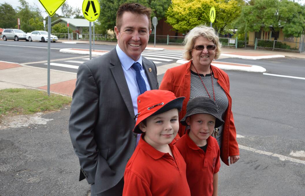 SAFETY: Member for Bathurst Paul Toole with Oberon Public School principal Bronwyn Ingersole and students Samuel Kavalieros and Kyle Odobasic at the upgraded pedestrian crossing in front of the school.