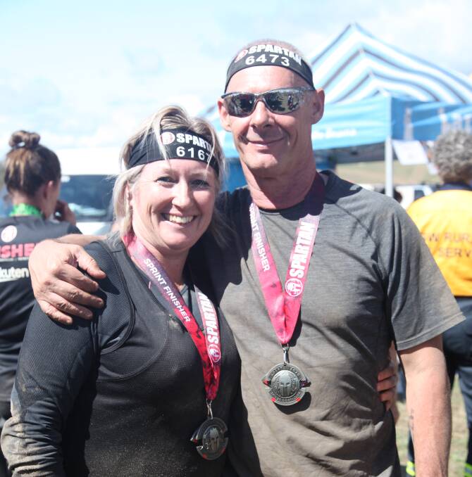 WE DID IT: Two Oberon Spartan participants, Sharon Foley and Geoff Oxley, took part in the world's largest obstacle and endurance race.
