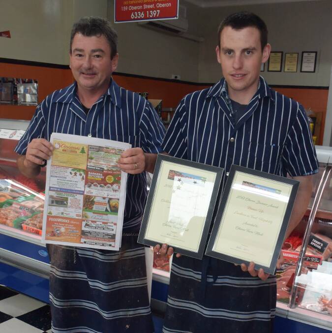 IT'S A WIN: Oberon Farm Meats' Darren Ball with employee Albert Whalan who is holding their OBTA awards they received at the awards dinner.