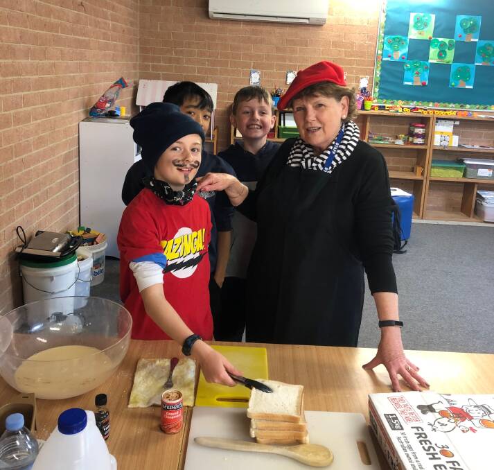 IN COSTUME: St Joseph's School's Mrs Simmons with Jake, Lian and Beau at their French Showcase Day.
