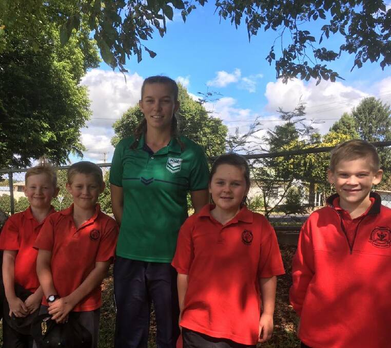 LEARNING: Tilly from Country Rugby League with Oberon Public School students Cooper, Levi, Harmyni and Boati from year two.