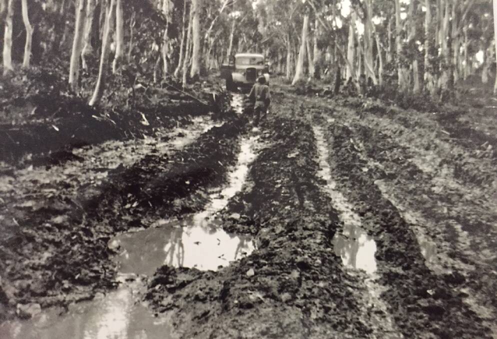 BOGGY: Ken Maloney's truck on the Abercrombie Road (or, as it was known then, the Goulburn Road) in 1950. It would take decades before it was sealed.