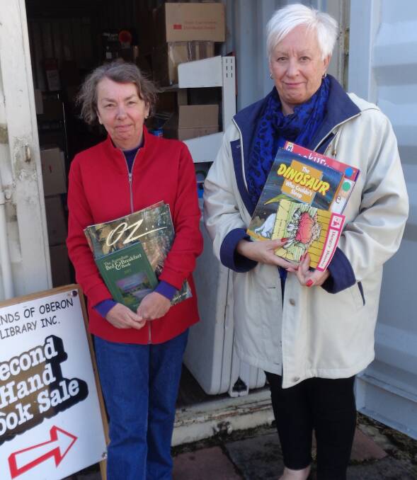 READY: Lyndle Hawkes and Kathy Sajowitz choose books from storage for the giant secondhand book sale to be held on September 21 and 22.