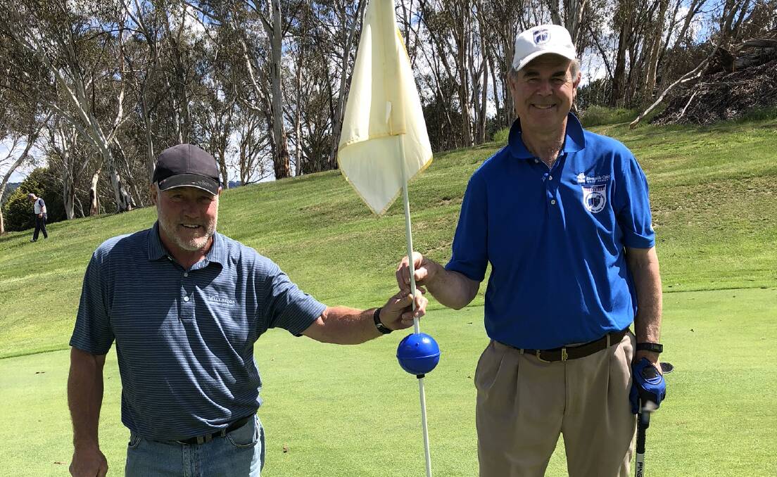 GOLFERS: Sean Mooney with men's golf A grade winner, Barry Lang.