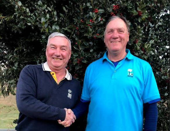 SMILE: Adrian Poulten congratulating Alan Cairney on his matchplay win at Saturday's men's golf tournament. Saturday was a good day for golf.