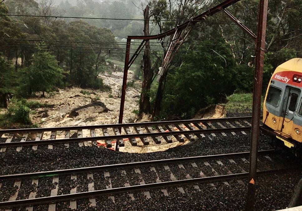 WASHED AWAY: First there were the bushfires, and now torrential rain has made the recovery operation even more difficult due to this landslip on the Blue Mountains rail line near Leura.