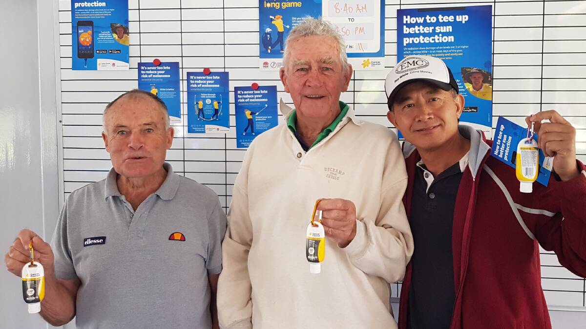 SUN SMART: A group of Thursday golfers showing off their sunscreen provided by the Cancer Council, which is promoting the use of sunscreen while playing the long game of golf.