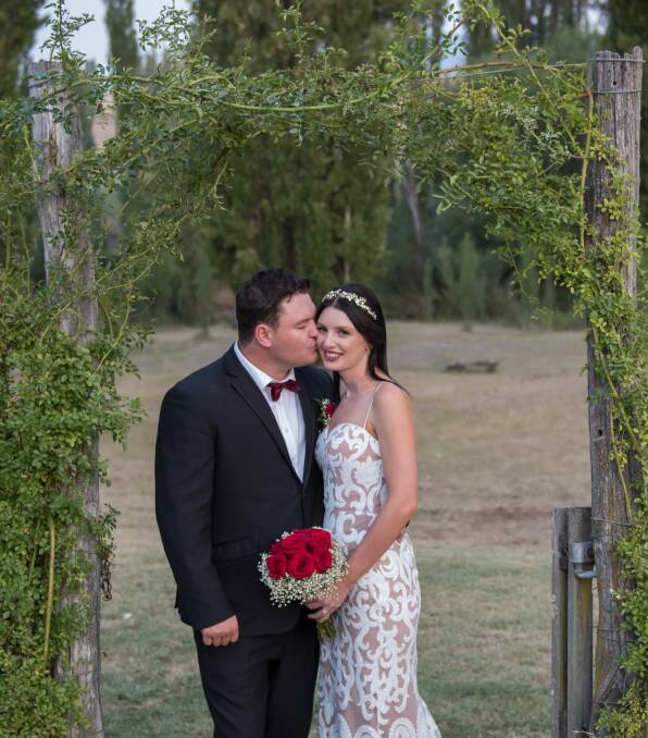 HAPPINESS: Jessica Miller and Dallas Booth held their wedding in the beautiful garden at Mutton Falls B and B. Photos: Candid Photos of a Lifetime.