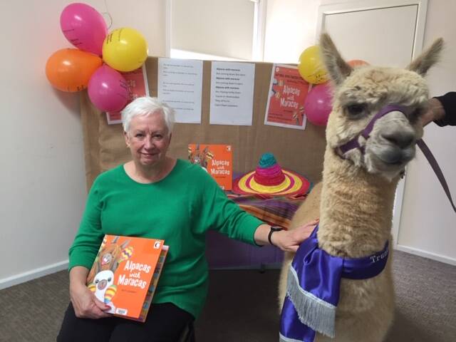 IT'S REAL: Mayor Kathy Sajowitz with Machi the alpaca at this year's National Simultaneous Storytime. Children enjoyed listening to Alpacas with Maracas.