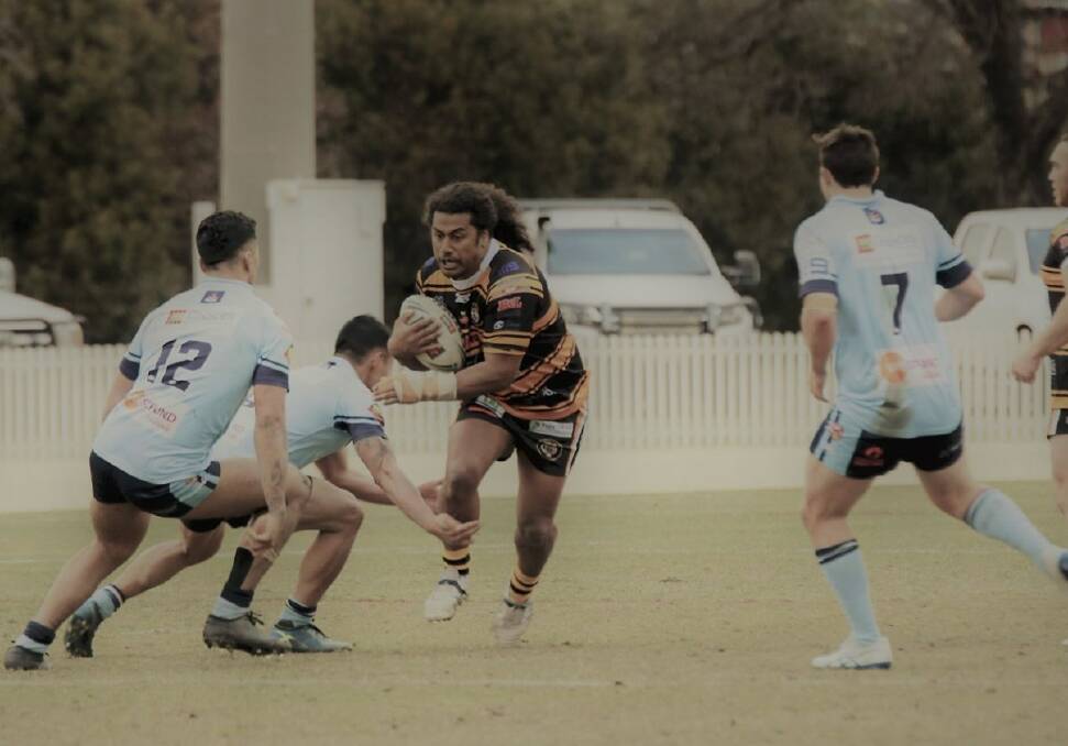 FORWARD: Oberon Tiger Abel Lefaoseu charges through Orange Hawks' defence in the Group 10 round at Wade Park last Sunday.