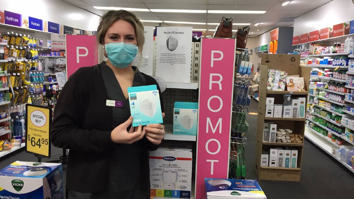 READY: Oberon Pharmacy staff member Madi Pincott says the pharmacy has a couple of different masks in stock.