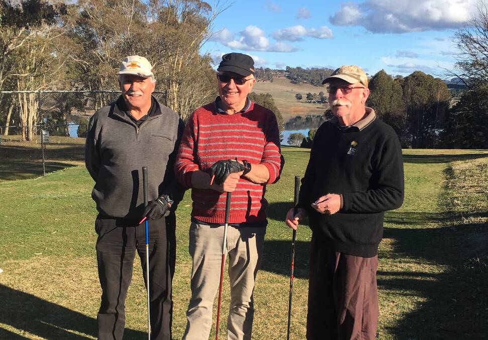 RELAXED: Dave Evans, Bruce Amery and Brian Balaam on the 13th tee enjoying a game of golf. It's been a mixed bag of weather for golfers recently.