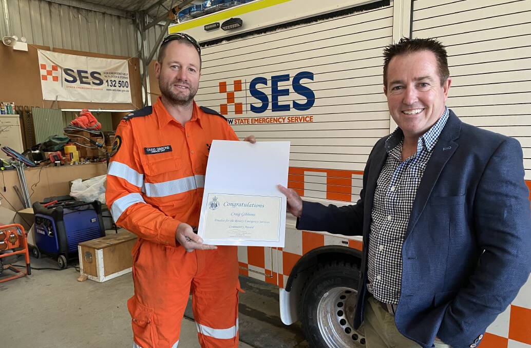 CONGRATULATIONS: Member for Bathurst Paul Toole with Craig Gibbons at the Oberon SES Headquarters..
