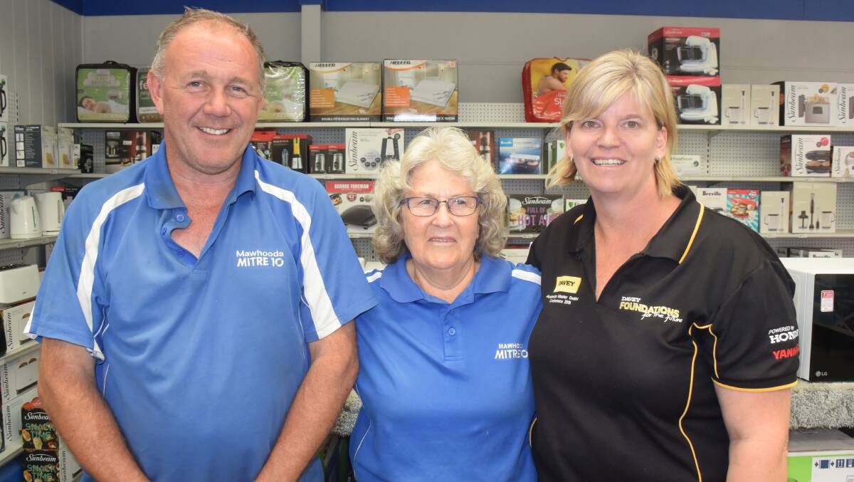 LONG INNINGS: Marj Bailey (centre), pictured with Gary and Kerrianne Mawhood, will retire next week.