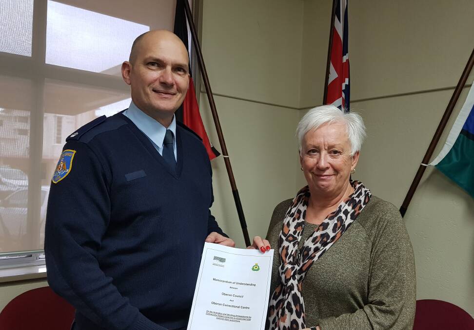 WIN-WIN: Shooters Hill Correctional Centre's manager of security Stuart Lyle with mayor Kathy Sajowitz at the re-signing of a memorandum of understanding between the centre and council.