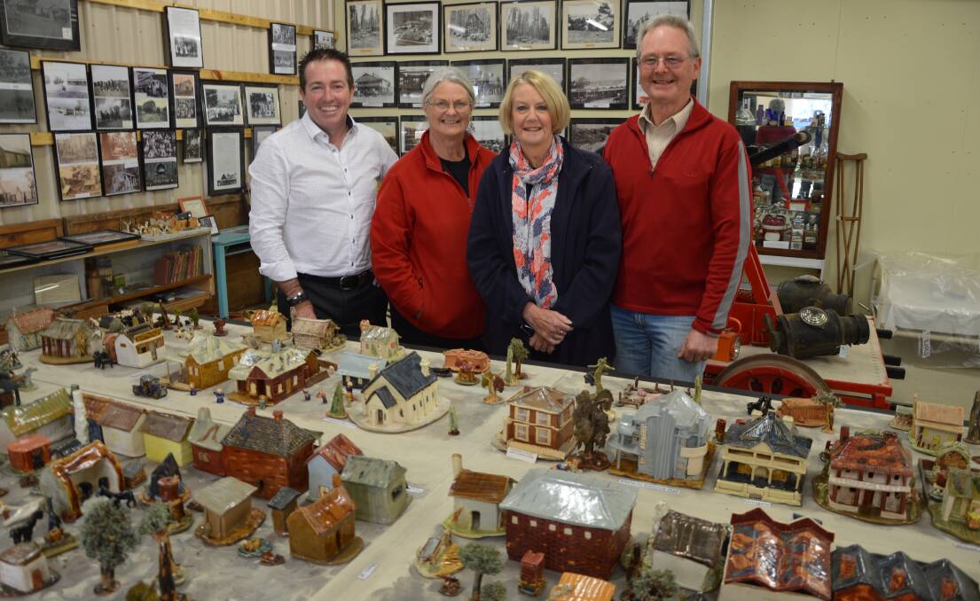 OBERON STREETSCAPE: Bathurst MP Paul Toole and Oberon District Museum volunteers Sue Roberts, Pam Dellow and Col Roberts with the pottery streetscape.