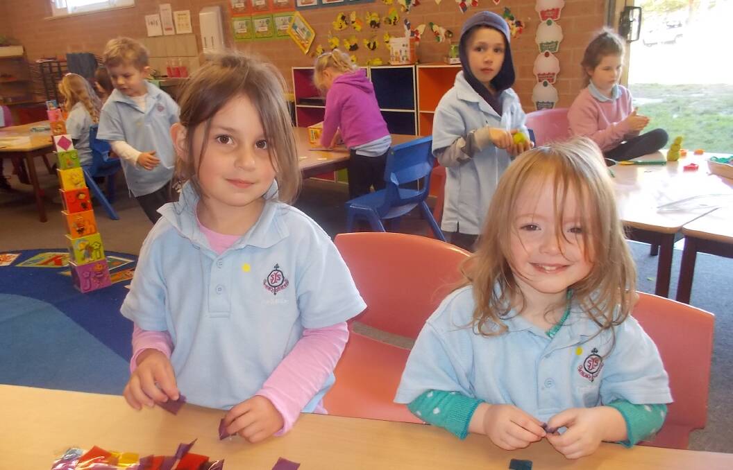 ACTIVE: St Joseph's Schools' pre kinder students Ryleigh Van Eeden and Jessikah Ryan enjoying some arts and crafts.