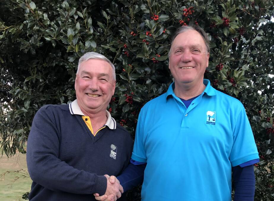 SMILE: Saturday's monthly medal sponsor Adrian Poulten congratulates A grade runner-up Alan Cairney. Saturday had a field of almost 40 golfers.