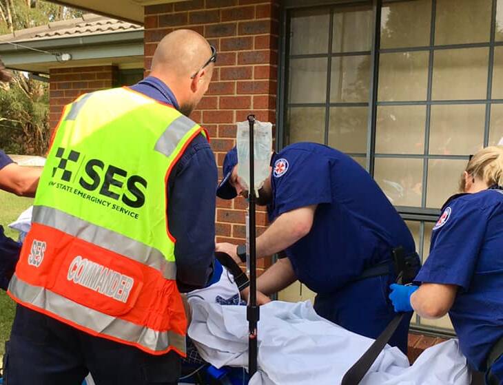 DEDICATED: Oberon SES commander Craig Gibbons assists NSW Ambulance paramedics with a patient call-out.