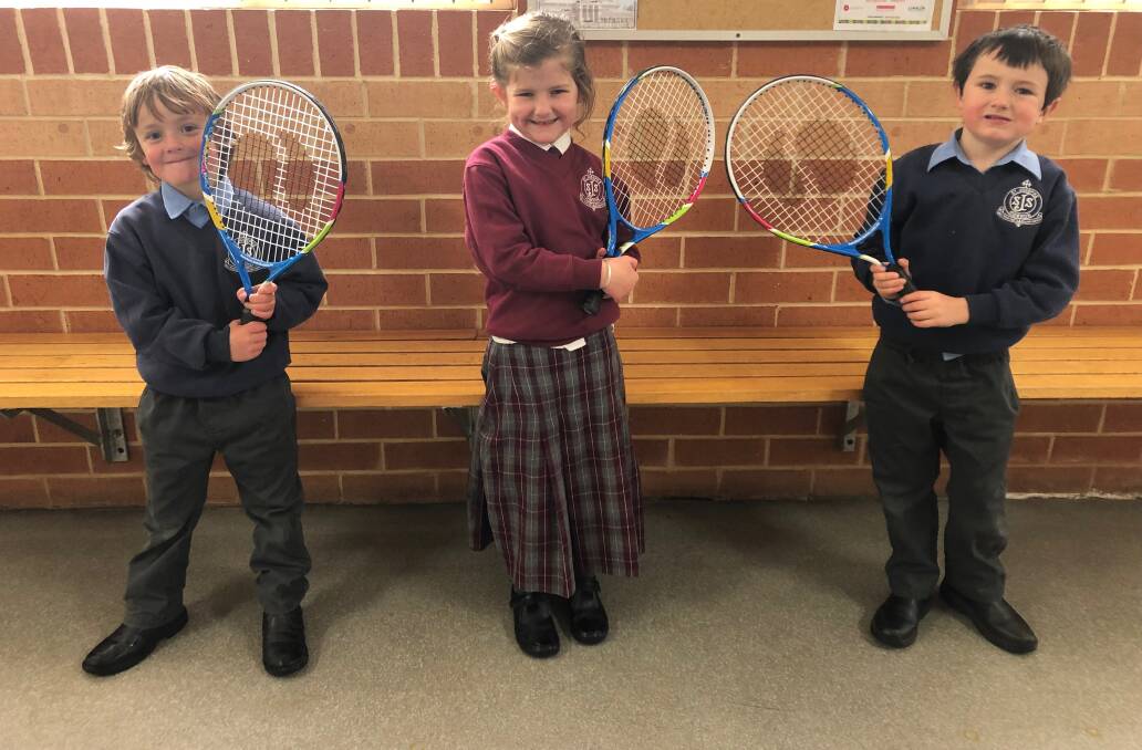 READY: Joey Ryan, Mackenzie Gilmore and Charlie Simmons from St Joseph's with the tennis racquets.
