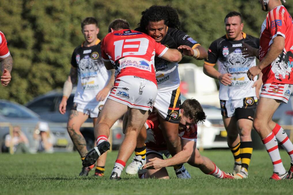 POWER: Oberon Tiger Abel Lefaoseu charges into the Mudgee Dragons defence during Saturday's Group 10 clash in Oberon.