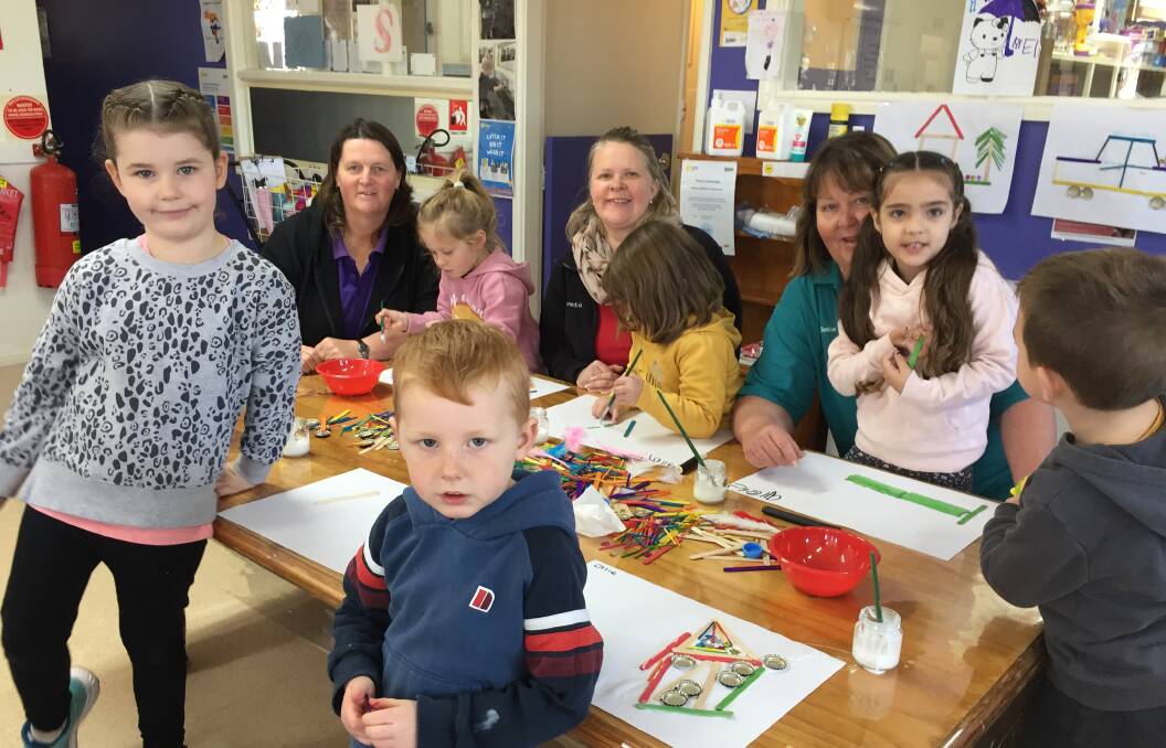 SUCCESS: Miss Kerry, Oberon Children's Centre director Meredith Cox and Miss Janice with students at the craft table.