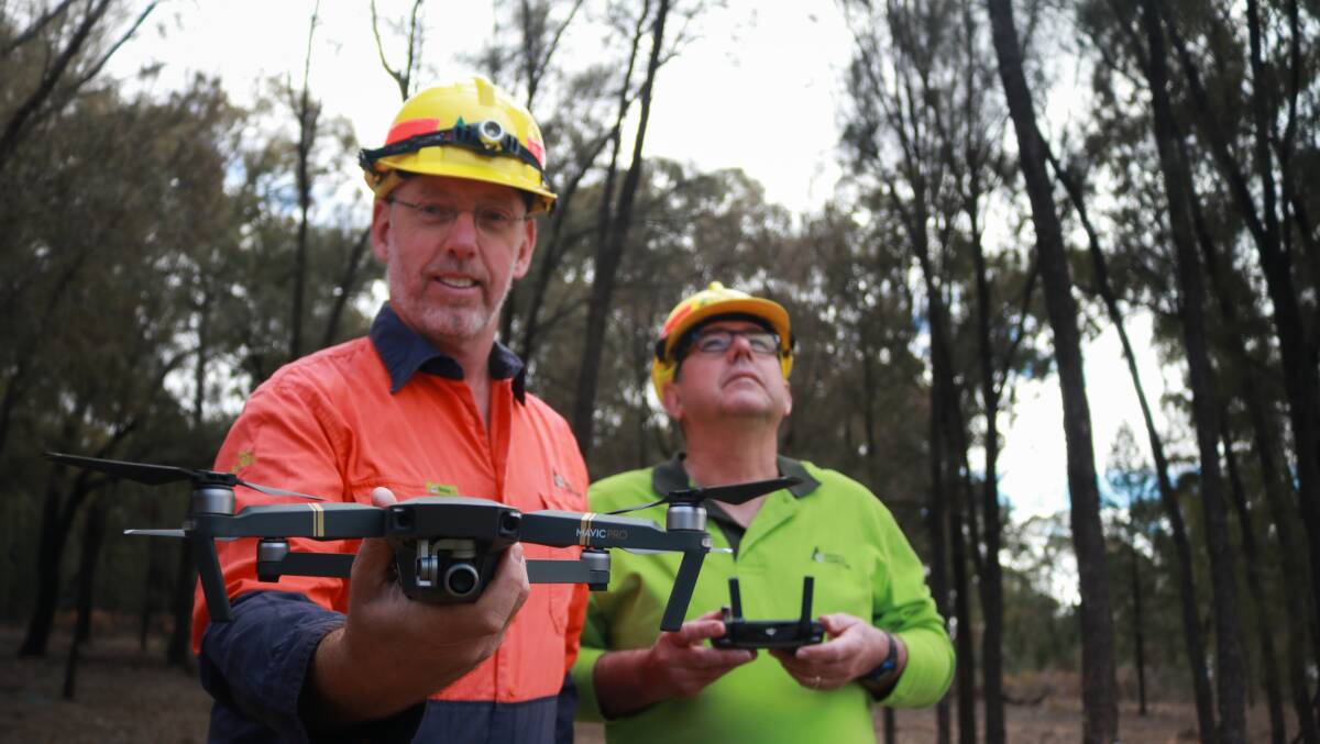 LOOKING UP: Forestry Corporation drone operators Dr Eric Smith and Conan Rossler. Drone technology will make it easier to identify the location of a fire.