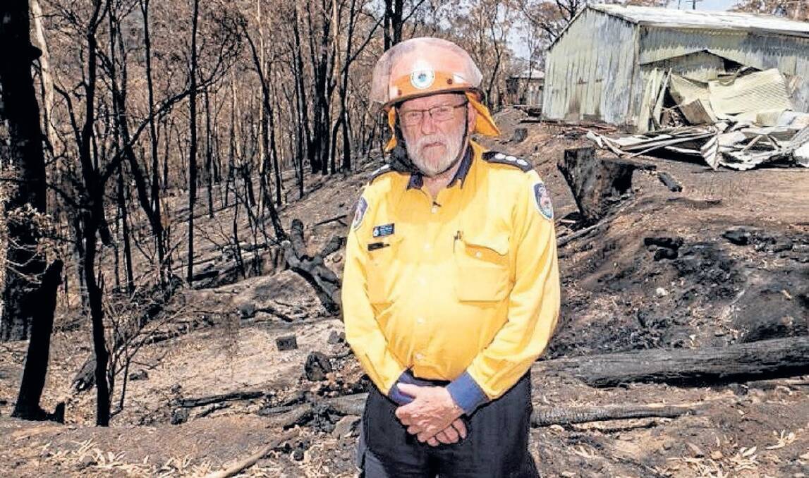 DEVASTATED: Jenolan Caves Rural Fire Service member Barry Richard in front of the brigade's burnt-out rural fire headquarters.