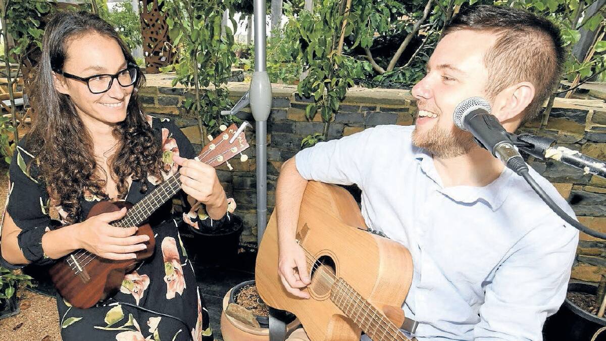 FRESH TUNES: Musicians Jodie Anderson and Aaron Strickland at the launch of Mayfield Garden's Fresh Fiesta on Sunday. Photo: CHRIS SEABROOK 010619cmayfld1