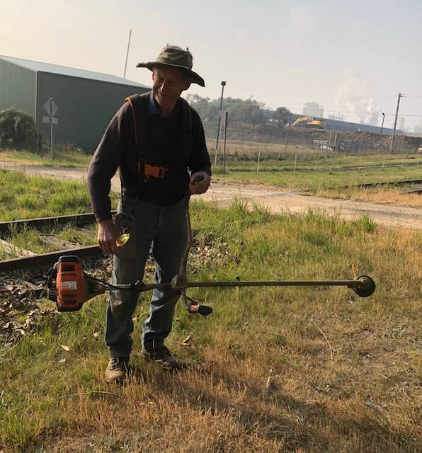 APPRECIATION: Barry Webb at work on Monday morning at the Oberon Tarana Heritage Railway site with his whipper snipper.