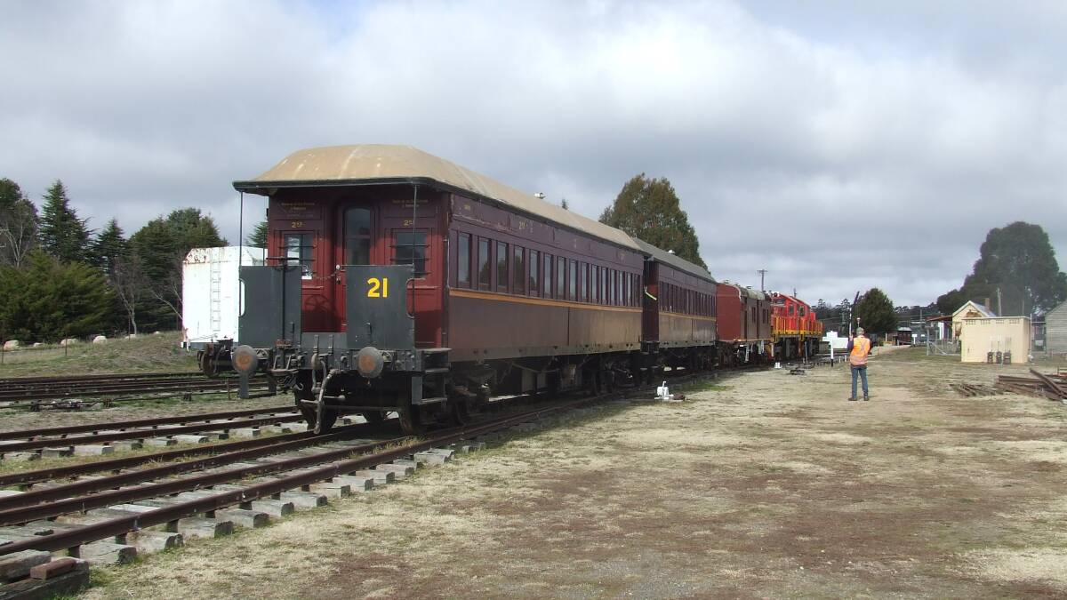 ON THE MOVE:  OTHR members moved the heritage 1897 End Platform Carriages to enable restoration work to continue.
