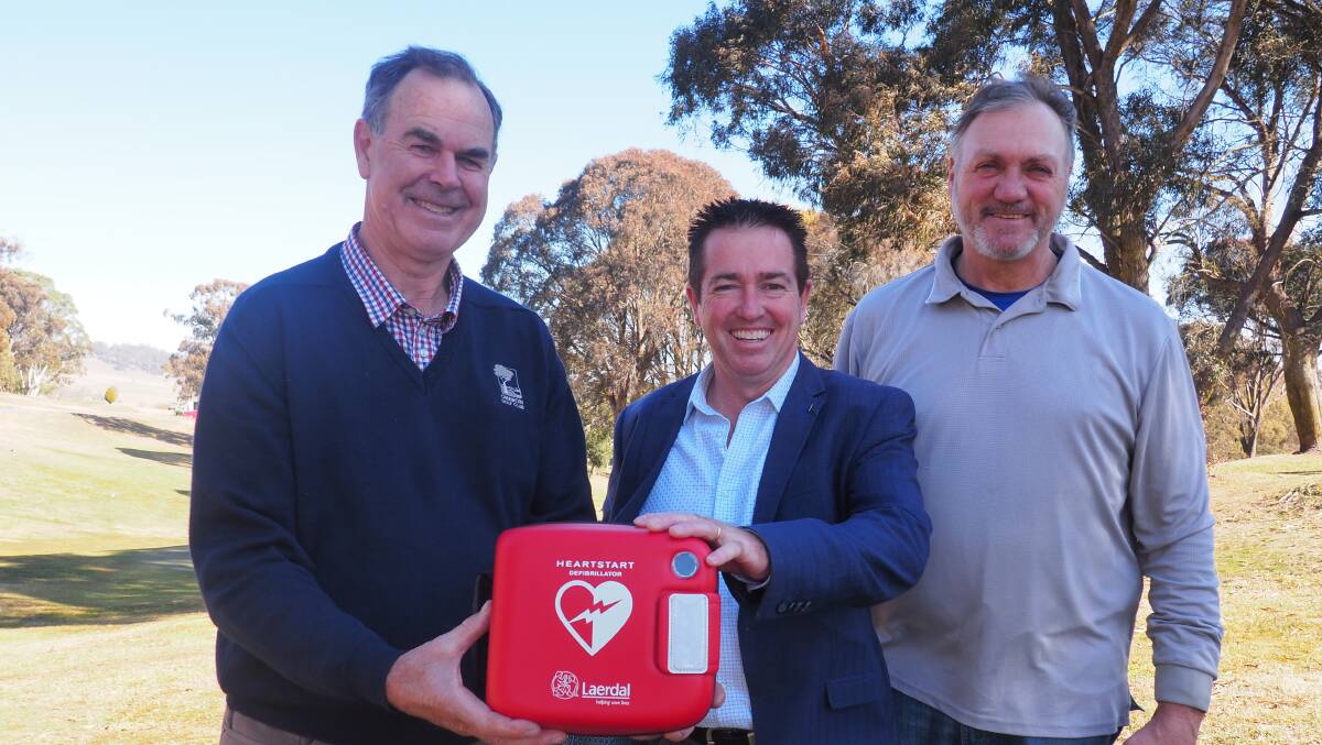 FUNDING: Oberon Golf Club members Barry Lang and Alan Cairney with Member for Bathurst Paul Toole. NSW Government grants for sports clubs to purchase life-saving defibrillators are again being offered. 