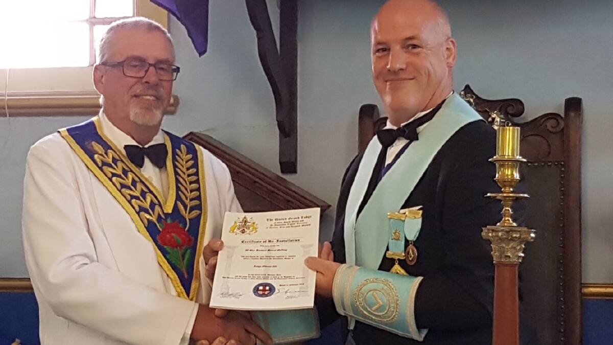 LEADER: Regional Grand Councillor Peter Stoneman reinstalls Worshipful Master of Lodge Oberon Lachlan Gelling for another two years.