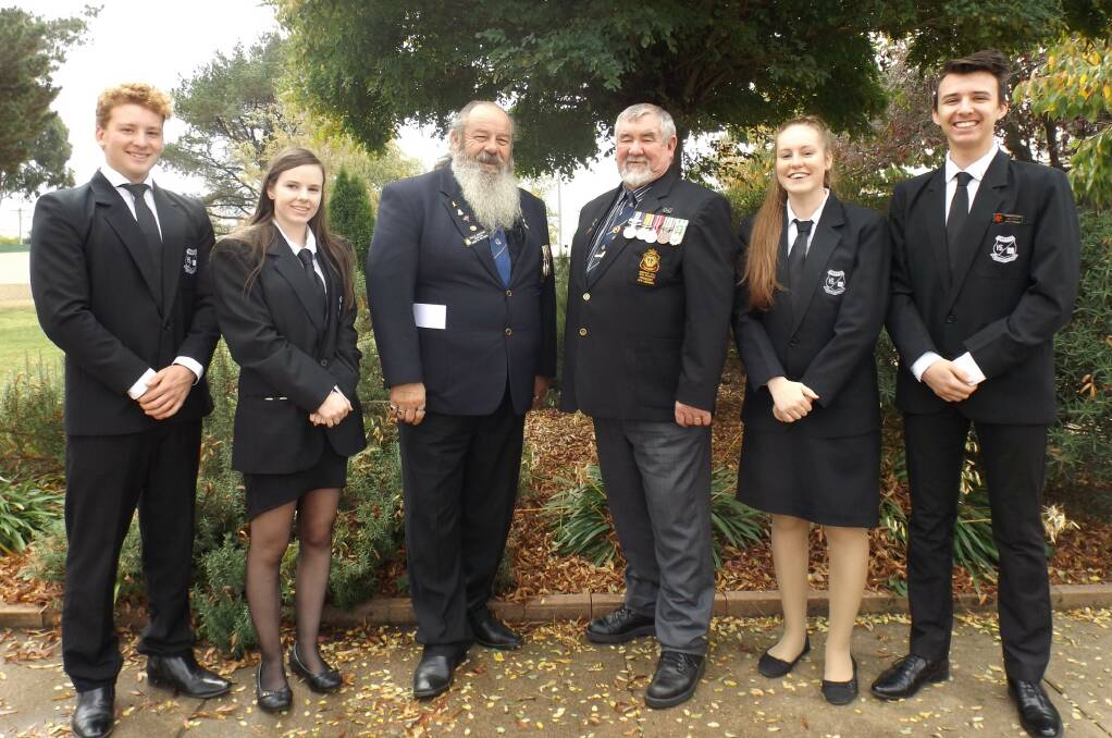 REMEMBERING: Oberon High leaders Rydah Leihn, Amy Reynolds, Susannah Curnuck and Baily Nielsen with sub branch members Neville Stapleton and Bill Wilcox.