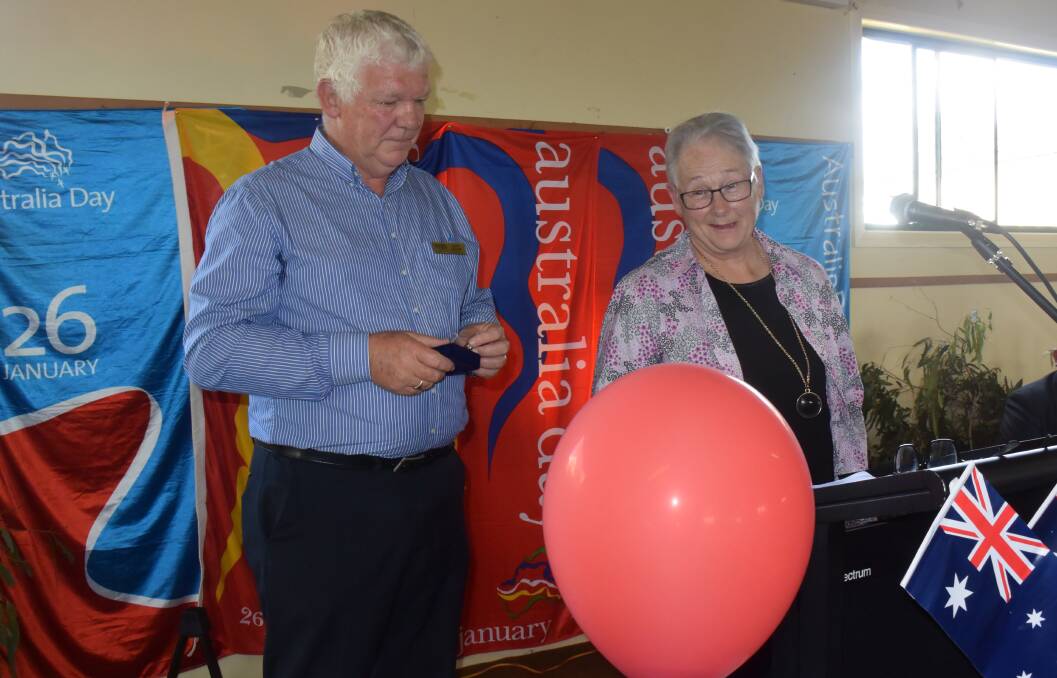 HONOURED: Councillor Mark Kellam presents Janet Clayton, who has made quilts and beanies for good causes over the years and helps with catering at the Uniting Church, with her Volunteer of the Year award on Australia Day.