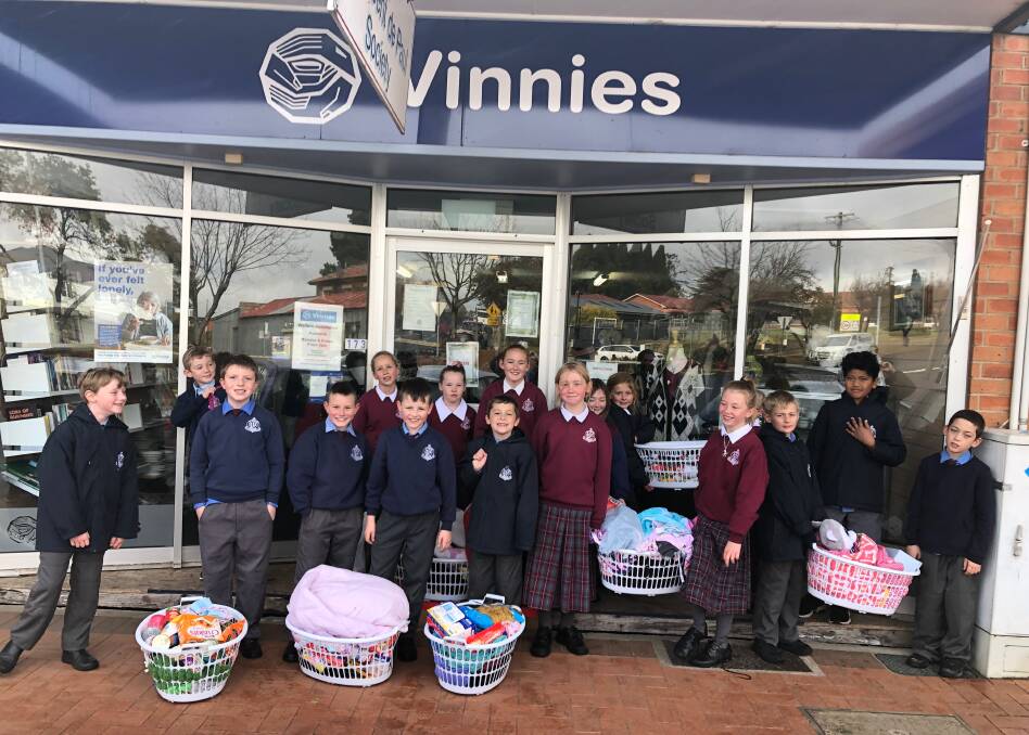 PROUD: St Joseph's School students deliver hampers to St Vincent de Paul for the Vinnies Winter Appeal to help those in need.
