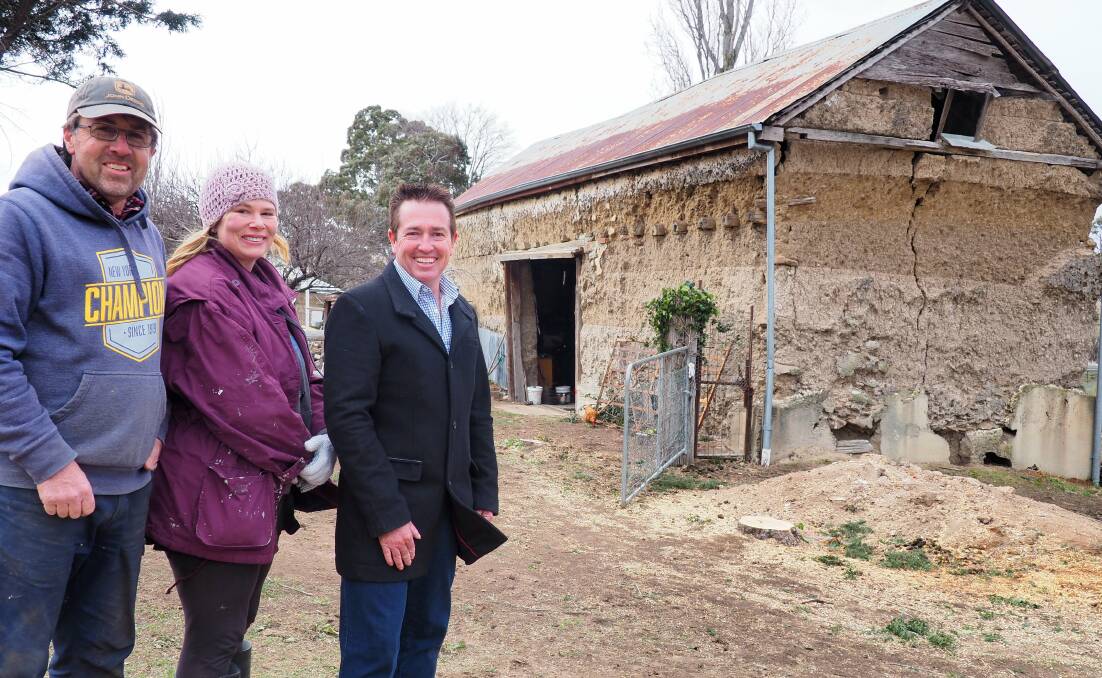 STILL STANDING: Owners Brad and Vanessa Hargans with Member for Bathurst Paul Toole outside Lindlegreen Barn at O'Connell.