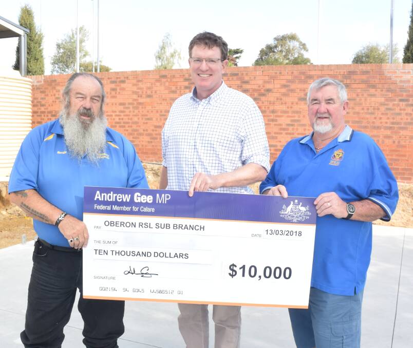 GRATEFUL: Oberon RSL Sub Branch secretary Neville Stapleton and president Bill Wilcox receive $10,000 from Member for Calare, Andrew Gee.