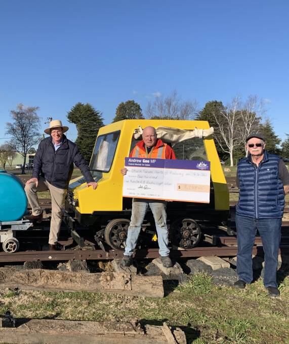 ON TRACK: Member for Calare Andrew Gee with Oberon Tarana Heritage Railway members Greg Bourne and David McMurray and a grant cheque for $9248.