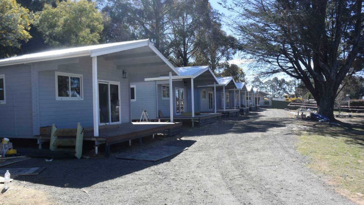 ADDITIONS: Eight new self-contained cabins are being installed at Jenolan Caravan Park. It's been a busy time for the park, which has had a change of management.
