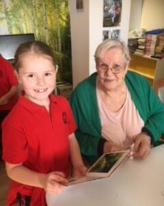 SMILE: Students from Oberon Public School enjoyed a visit to read to residents from Columbia Aged Care facility.