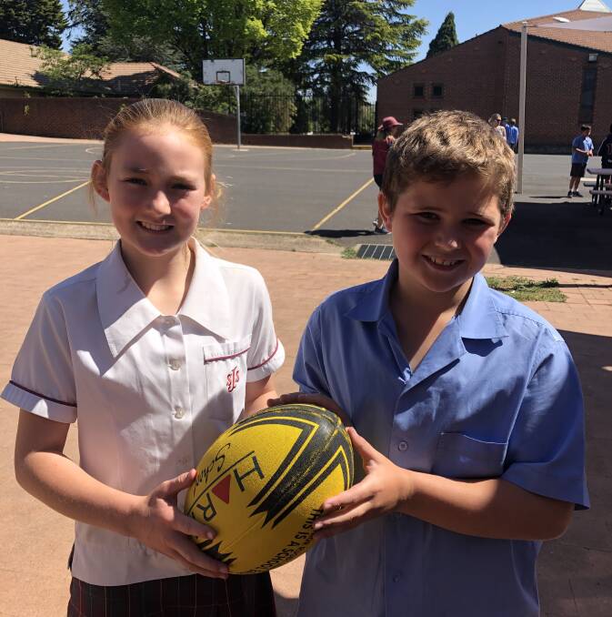 EXCITED: Students Grace O'Neill and Riley Murphy represented St Joseph's in touch football at Dubbo.