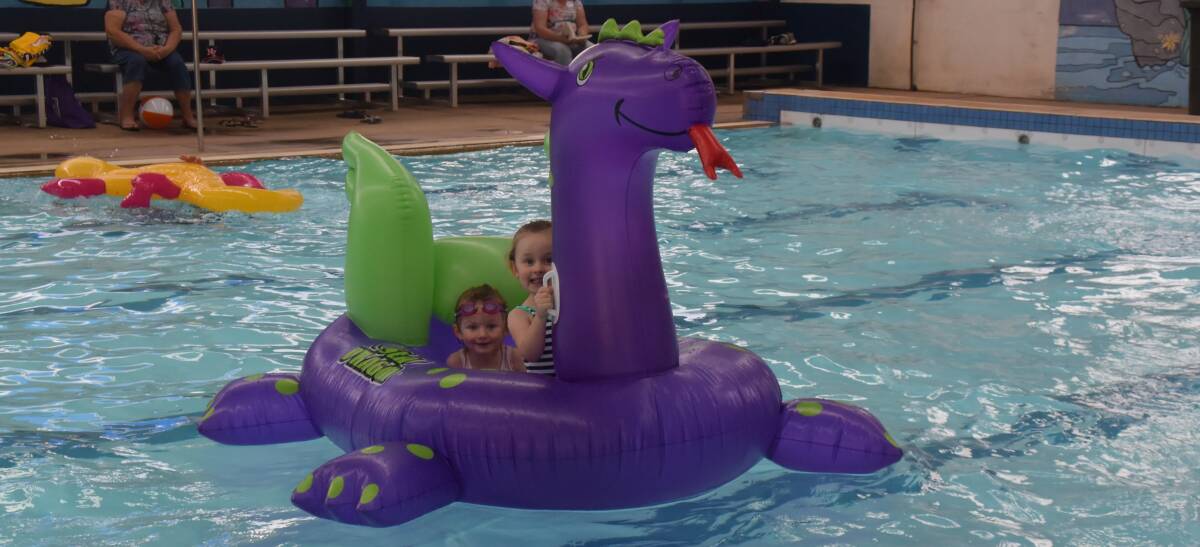 FUN:  Eve and Marley enjoying the inflatables at the Oberon pool on Australia Day.