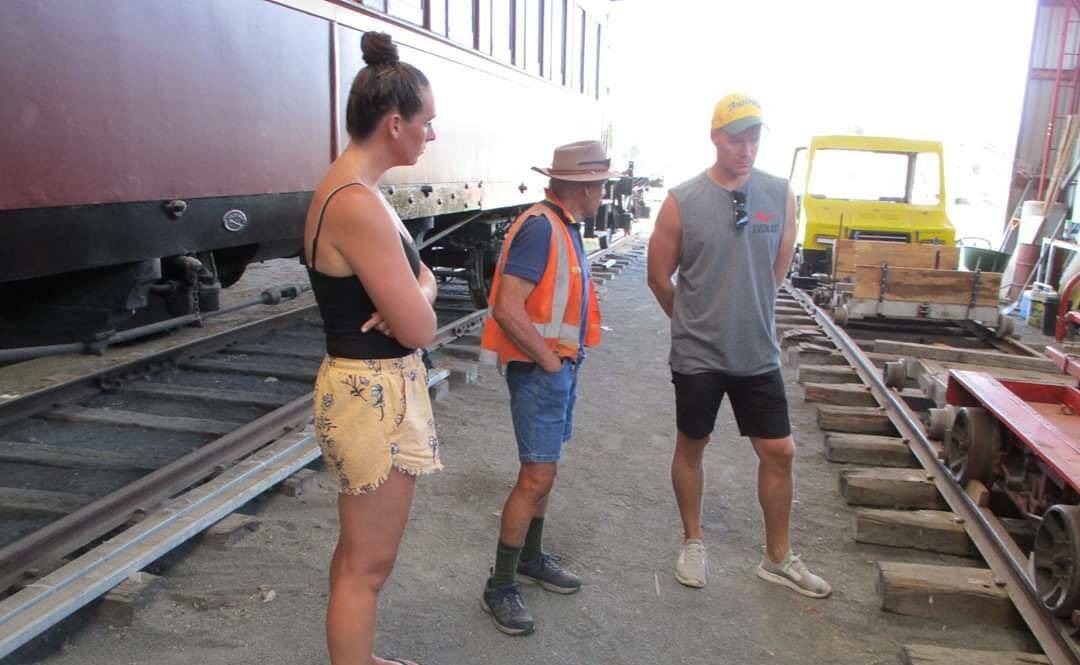 INTEREST: Oberon's Australia Day ambassador Elysha O'Neill and her partner Jacques on a tour of the Oberon Tarana Heritage Railway site with Arthur Robinson.